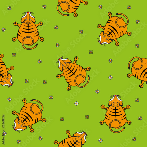 Fototapeta Naklejka Na Ścianę i Meble -  Seamless vector pattern for children. Tiger cub top view and chamomile on a green background.
