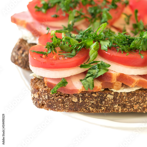 Freshly prepared buterbod ham on the plate isolated on white background.