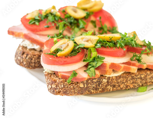 Freshly prepared buterbod ham on the plate isolated on white background.