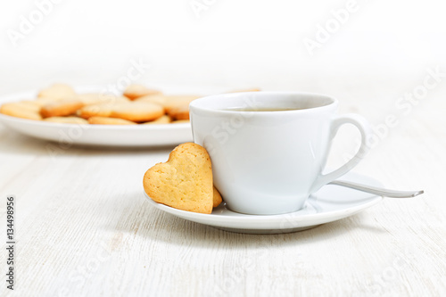 Heart-shaped cookies and a cup of tea