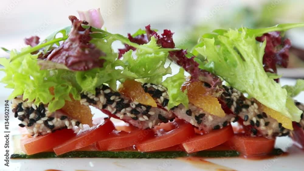 luxury expensive restaurant dish with sweet aromatic rolls with sesame seeds served with orange and fresh salad luxury expensive restaurant dish with sweet aromatic rolls with sesame seeds served with orange and fresh salad
