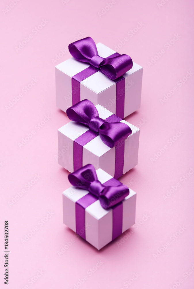 Gifts with satin bows on pink Gifts with satin bows on pink