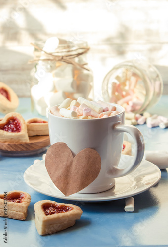 cocoa with marshmallows and a cookie heart. Selective focus.   photo