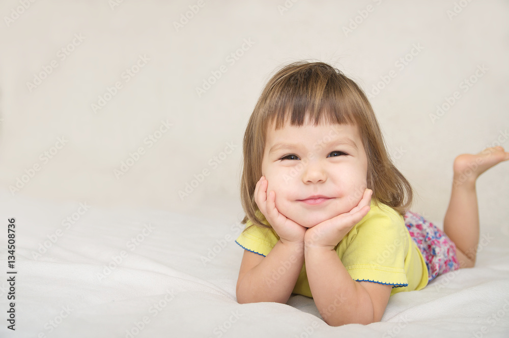 smiling happy little girl portrait with cute cheeks isolated smiling happy little girl portrait with cute cheeks isolated