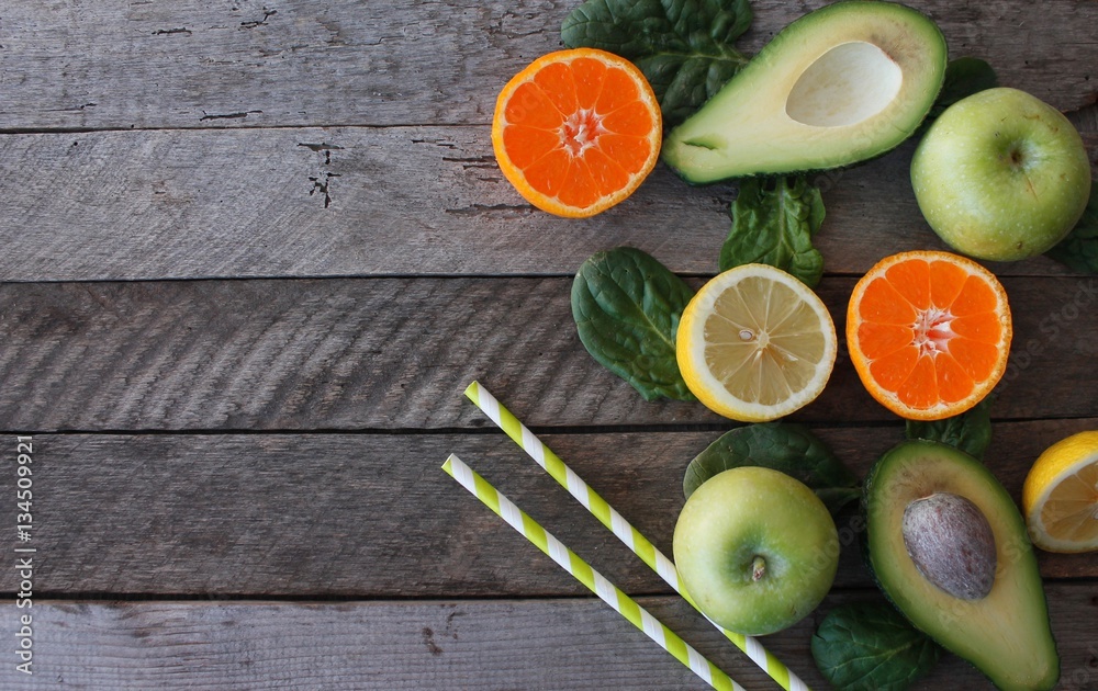 Various citrus fruits on a wooden surface. Fruit food background. Healthy eating and diet. Various citrus fruits on a wooden surface. Fruit food background. Healthy eating and diet.