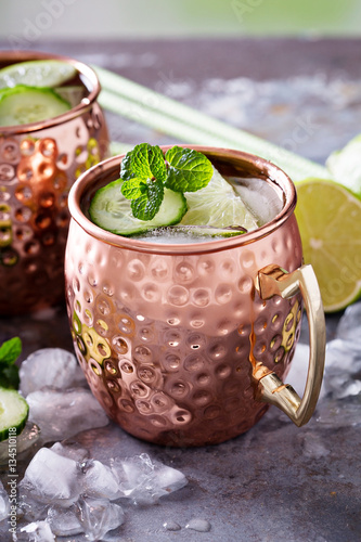 Photography Moscow mule cocktail with lime and cucumber