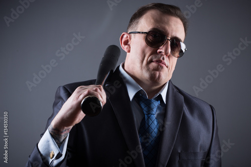 male gangster with baseball bat photo