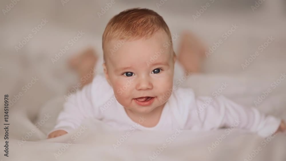 Portrait of four month old baby lying on his stomach Portrait of four month old baby lying on his stomach