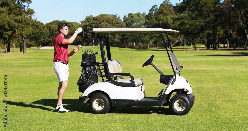 Male golf player removing golf club from golf bag at golf course 4k Male golf player removing golf club from golf bag at golf course 4k