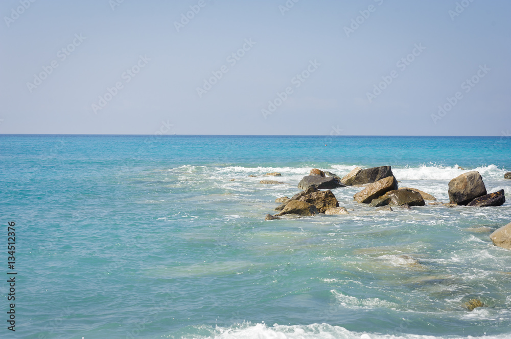 Seascape. The coast of the Ligurian Sea, with turquoise water.