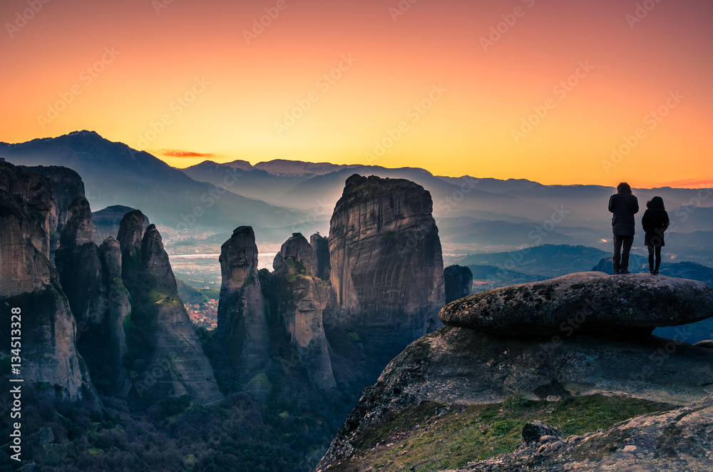 Breathtaking view of Meteora at sunset, Greece. Geological formations of big rocks with Monasteries  on top of them.