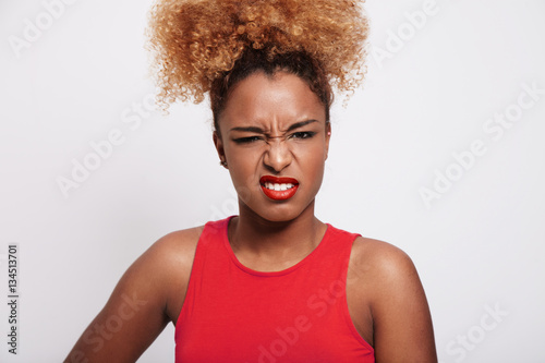 angry black woman screw up her face