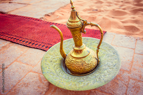Canvas-taulu amazing golden arabic coffee pot is served in bedouin tent