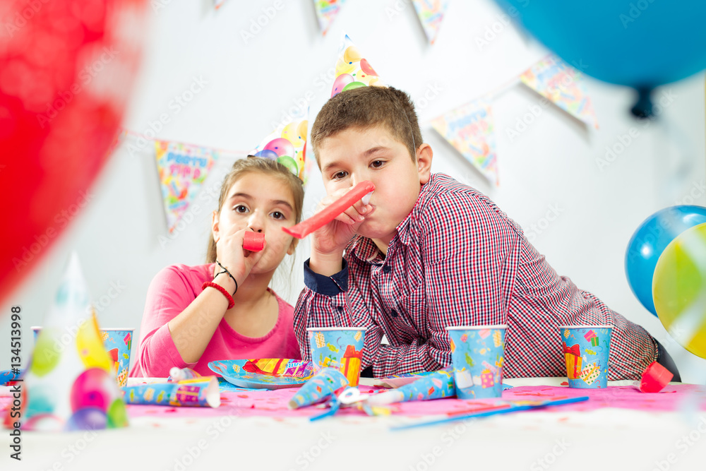 Fototapeta premium Happy group of children having fun at birthday party