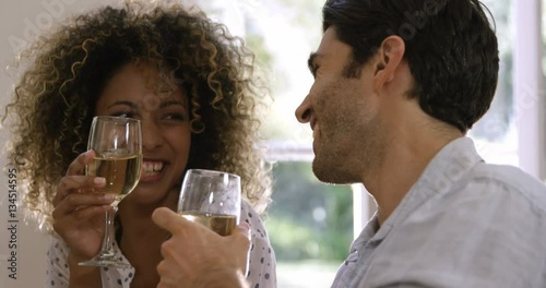 Happy couple having wine at home 4k