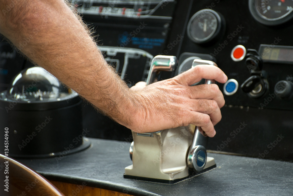 Captain's hand on ship throttle. Captain's hand on ship throttle.