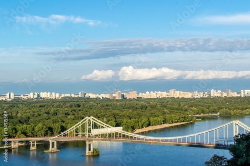 Kiev City, landscape, view of the bridge from above. Beautiful views of the Dnipro River, Texture clouds and foliage. © svitlananiko