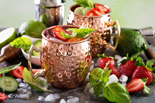 Moscow mule cocktail with lime and strawberry