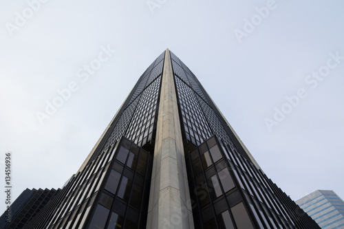 Picture of a 70 s office skyscraper in Montreal  Quebec  Canada  seen from the bottom
