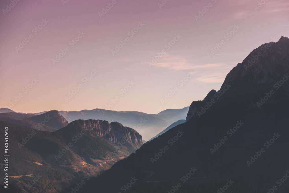 Mountain landscape and forests at sunset
