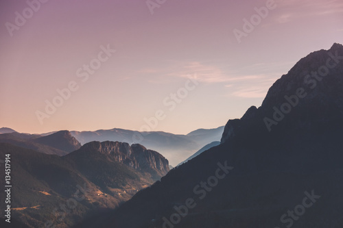 Mountain landscape and forests at sunset