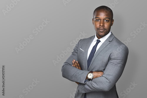 Fotografija Successful confident black business man isolated with arms folded looking strong