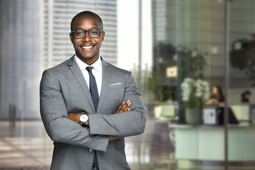 Happy company leader CEO boss executive standing in front of company building