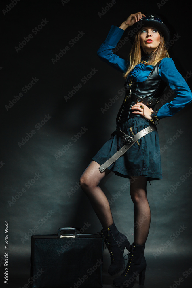 Steampunk girl with retro bag.