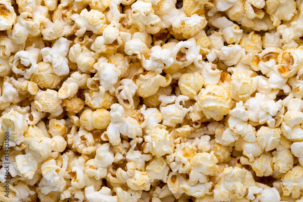 Popcorn background. Caramel sweet corn. Cinema snack. Popcorn background. Caramel sweet corn. Cinema snack.