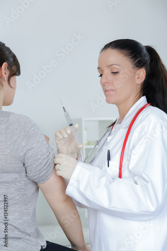 doctor injecting patients hand