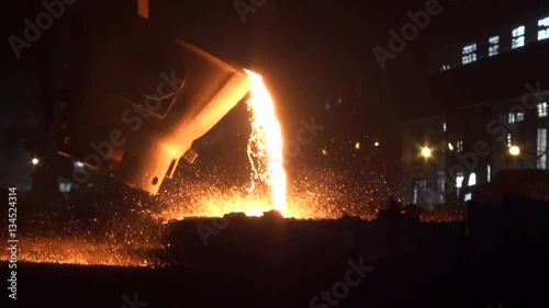 Iron and Steel Works. Pouring of molten iron.