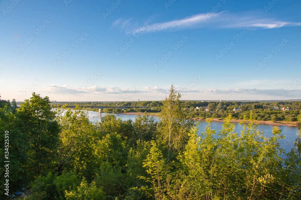 Beautiful river view through the trees from a high place