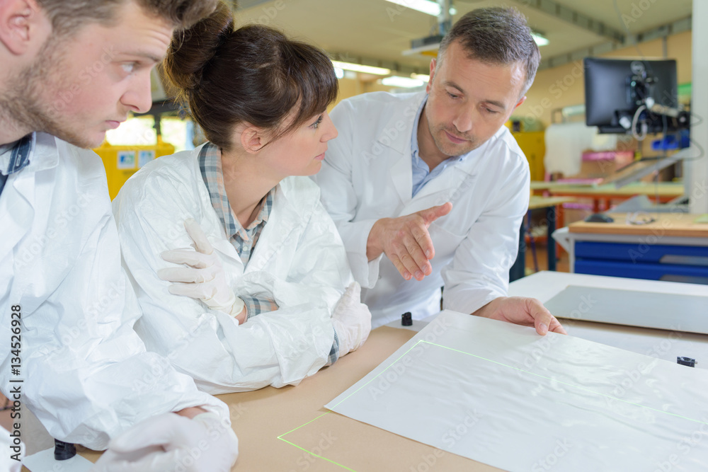 Fototapeta premium People studying paperwork