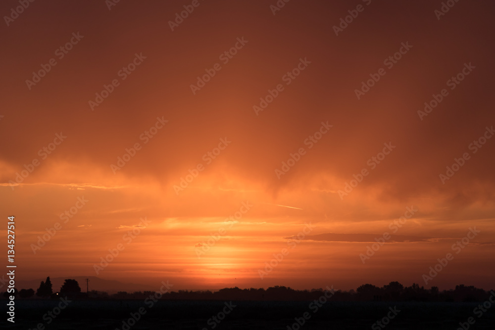 Colorful orange cloudy sunset