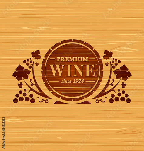 Vector wine emblem with grape bunches and grape leaves on a wooden background