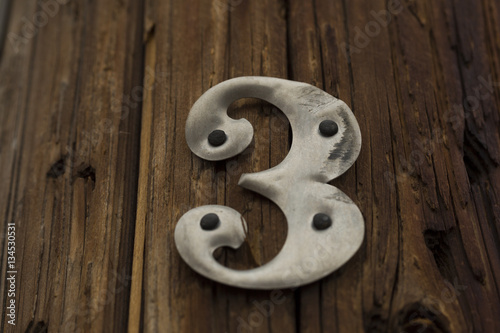 Metal Number 3 on Wood