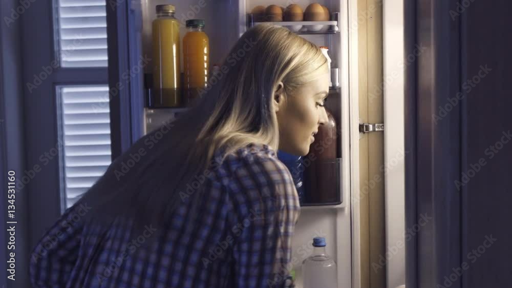 Woman Taking Tart From Fridge
