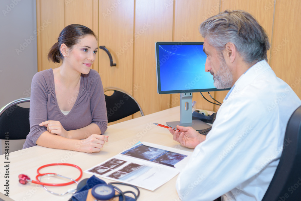 Fototapeta premium Doctor in consultation with female patient
