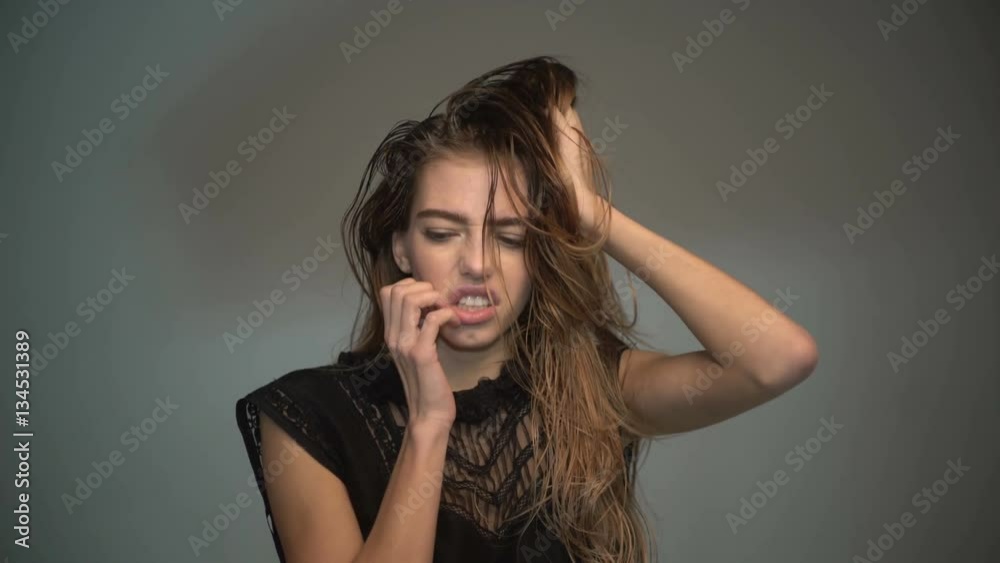 Young girl scratching her head, face, ear and laughing. Cheerful girl has scabies, itch, scratch or pretend and simulator Young girl scratching her head, face, ear and laughing. Cheerful girl has scabies, itch, scratch or pretend and simulator