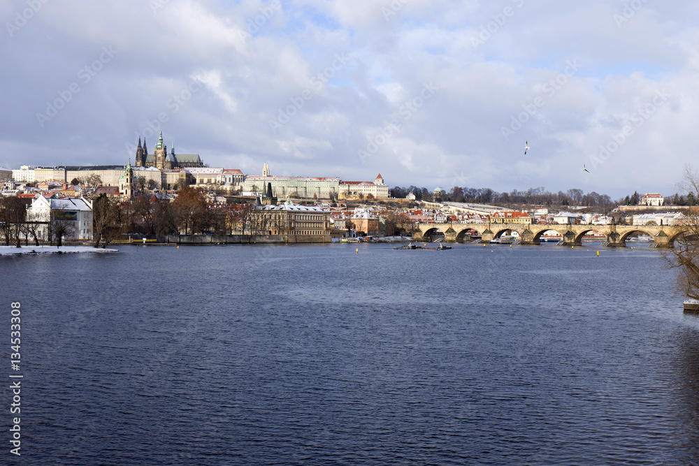 Snowy freeze Prague Lesser Town with gothic Castle and Charles Bridge, Czech republic