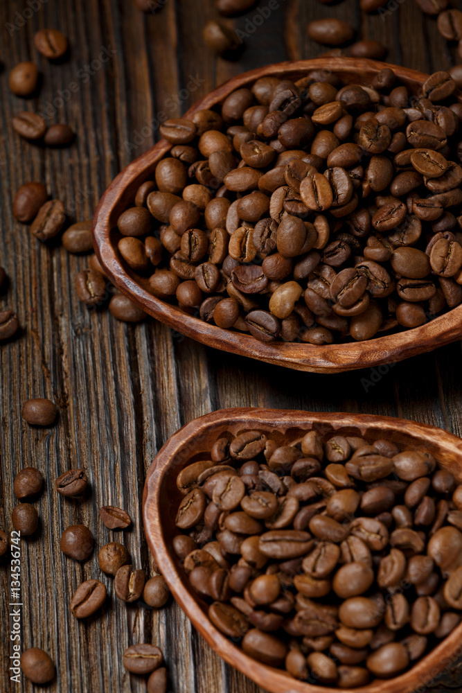 Coffee beans on a wooden desk Coffee beans on a wooden desk
