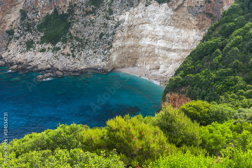Blue water and rocks of beach at Zakynthos island, Greece