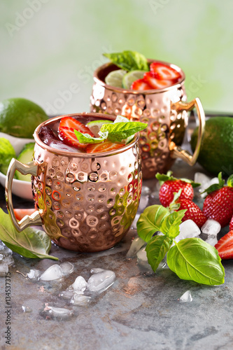 Moscow mule cocktail with lime and strawberry