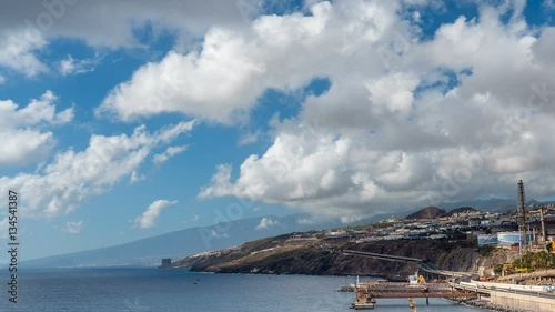 The road along the ocean in the city. Canary islands. Tenerife. Santa cruz. Timelapse. photo