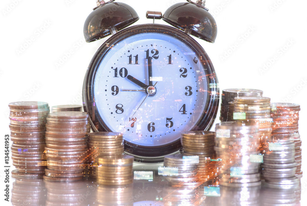 Double exposure rows of coins and alarm clock with city background, Finance and money saving concept Double exposure rows of coins and alarm clock with city background, Finance and money saving concept