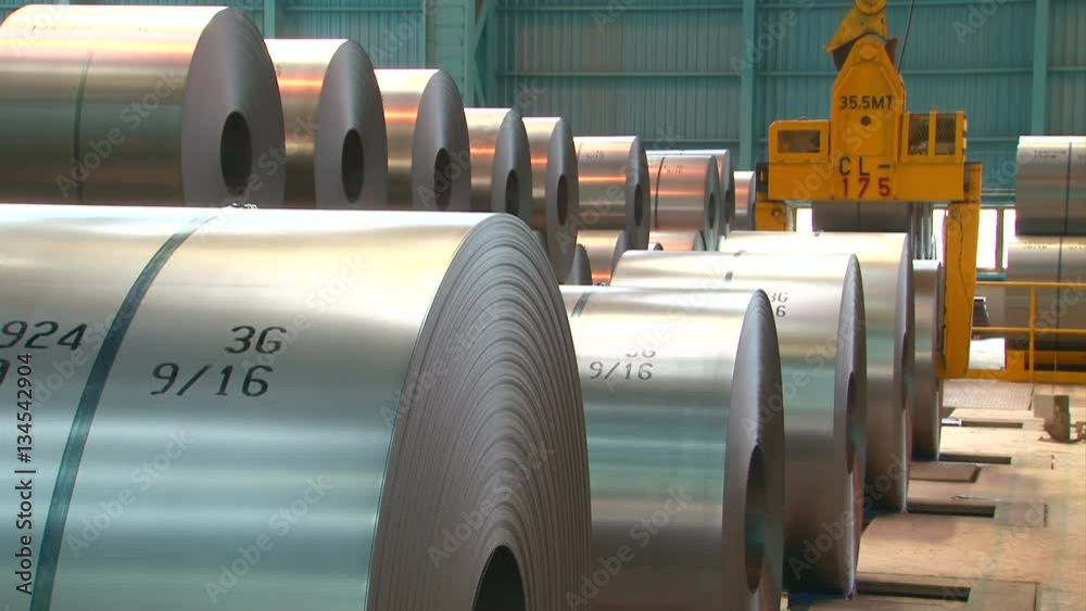 Transporter moves big roll of aluminum at metallurgical plant HDV to HD