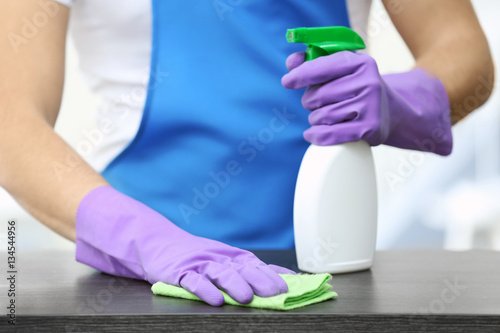 Closeup of man cleaning table