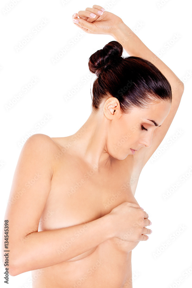 Young woman examining her breast Young woman examining her breast