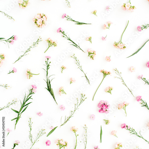 Fototapeta Naklejka Na Ścianę i Meble -  Floral pattern with pink and beige wildflowers, green leaves, branches on white background. Flat lay, top view. Valentine's background