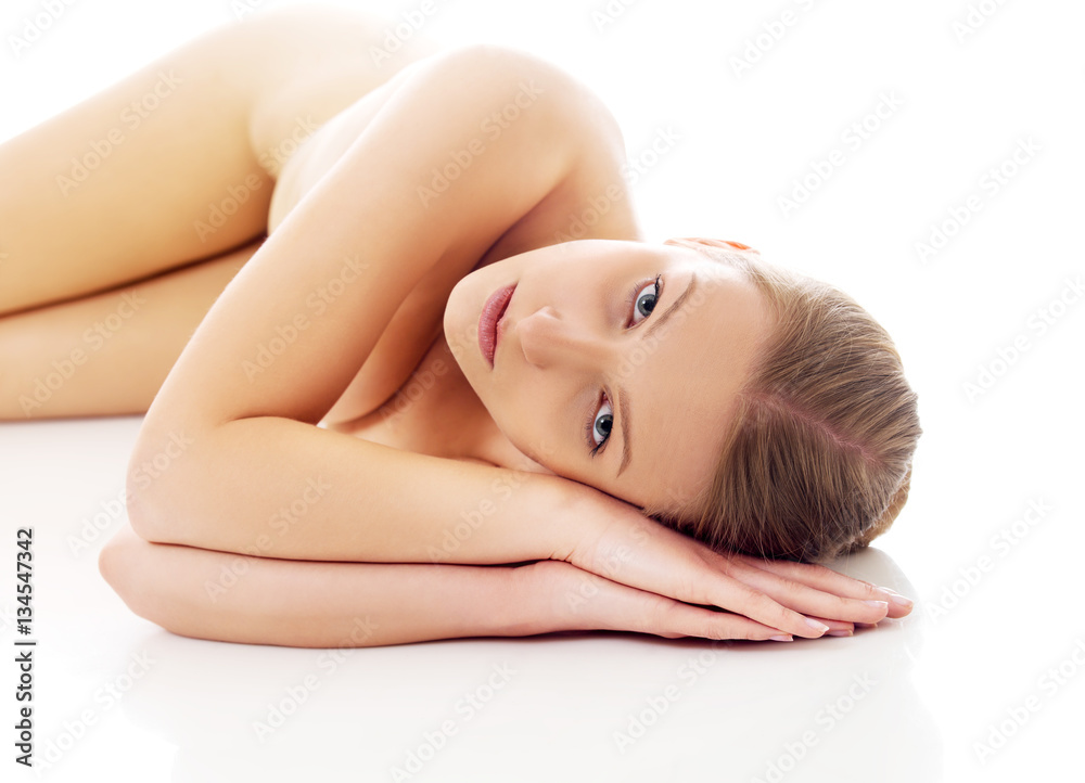 Fototapeta premium Nude woman lying on the floor
